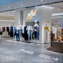Projection arrow and bright logo on wall and floor for store