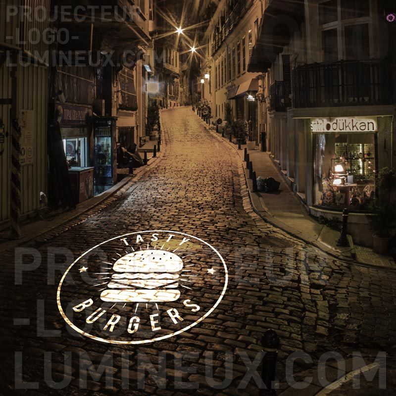 Projecteur logo lumineux restaurant rue trottoir