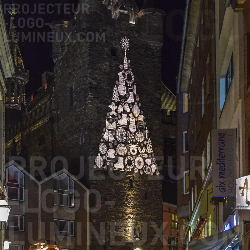 Luminous Christmas tree projection on building Luminous Christmas tree projection on building
