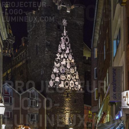 Luminous Christmas tree projection on building