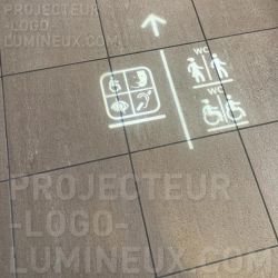 Luminous arrow projector and floor pictogram
