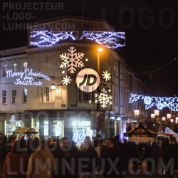 Proyección de pared y fachada de copo de nieve iluminada para iluminación