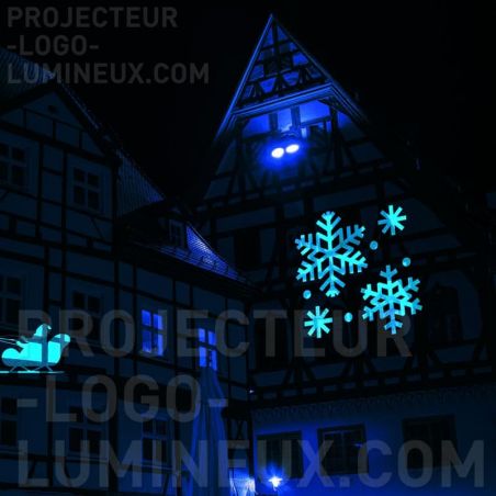 Snowflake light projection on building