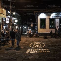 Illuminated logo projection in street for fast food