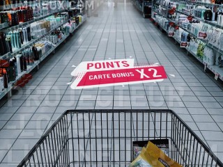 Illuminated advertising projected on the store floor